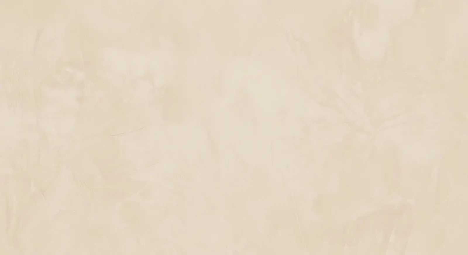 A soft cream plastered-wall texture, subtly mottled, filling the frame