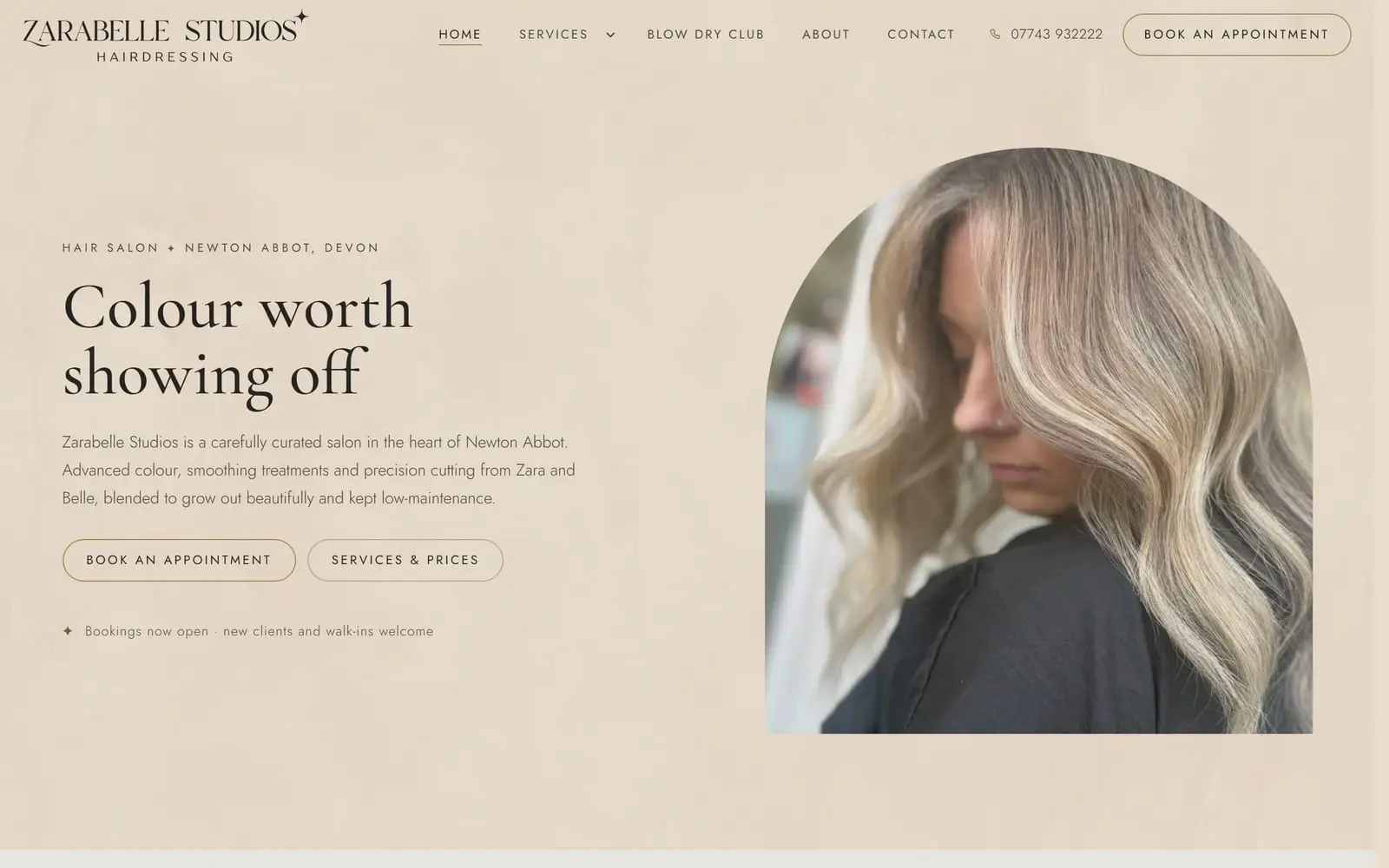 A hair salon website shown in a browser window with the matching phone view: warm sand background, an arched portrait of blonde balayage, and the headline "Colour worth showing off"